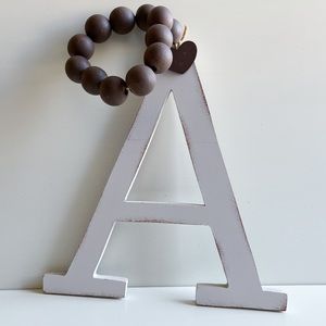 Kirkland’s Distressed Wooden Monogram Letter A Hanging Wall Art Decor